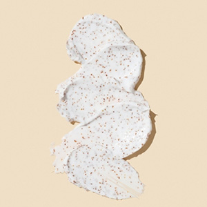 Close up of exfoliant cream on a beige background